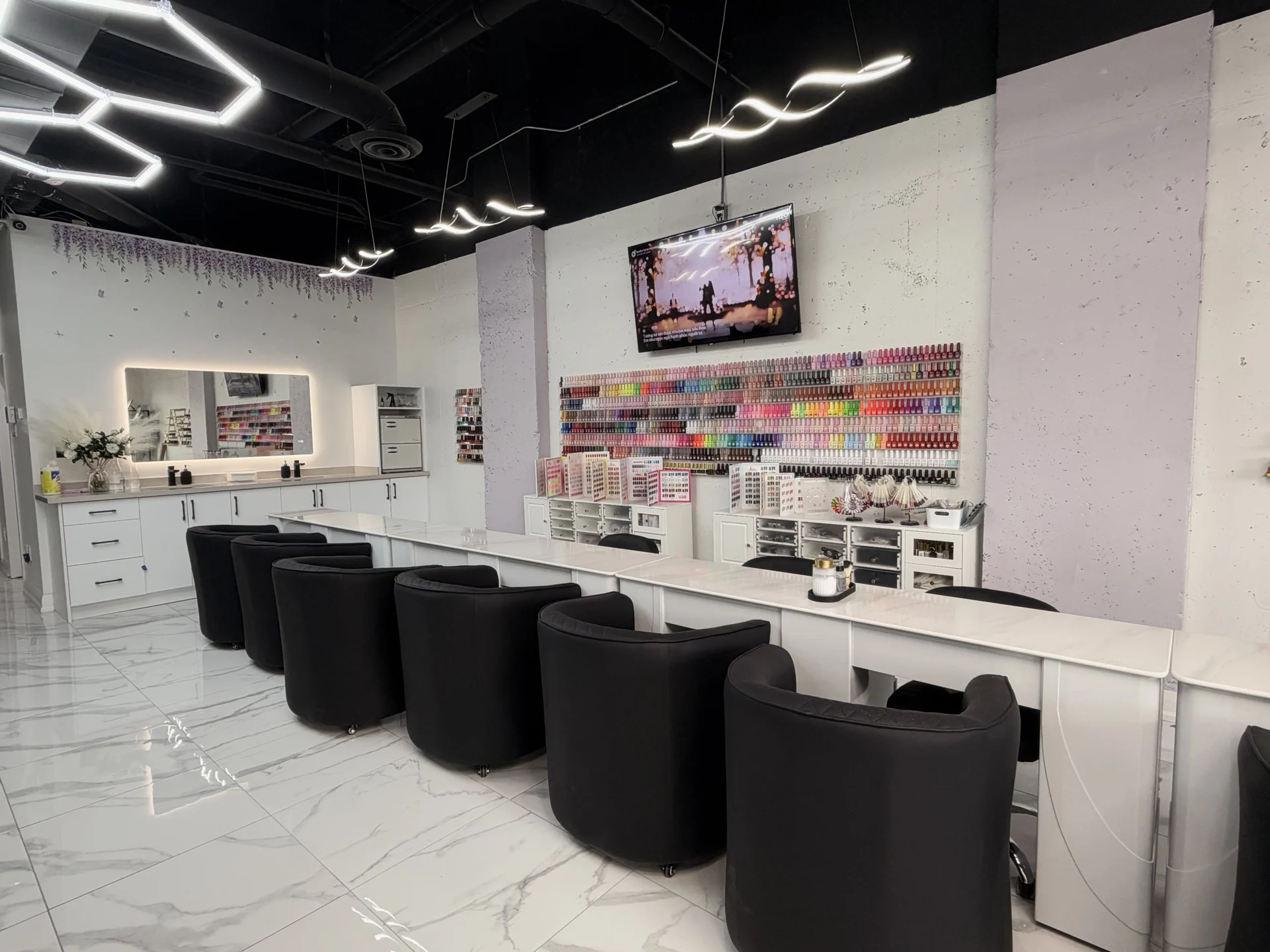 A closer view of Periwinkle's manicure tables and lilac walls